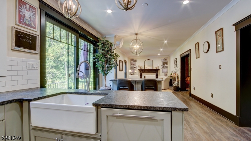119 Broadway Road Cranbury, NJ 08512 - Photo 14 of 26 a kitchen with a sink a refrigerator and a stove top oven