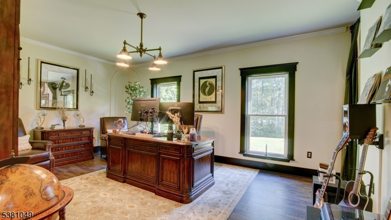 119 Broadway Road Cranbury, NJ 08512 - Photo 20 of 26 a living room with furniture a flat screen tv and a window