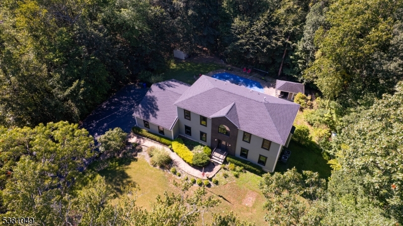 119 Broadway Road Cranbury, NJ 08512 - Photo 2 of 26 a view of a house with a yard covered with snow in the background