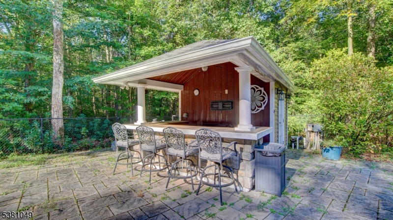119 Broadway Road Cranbury, NJ 08512 - Photo 26 of 26 a view of a chair and table in backyard of the house