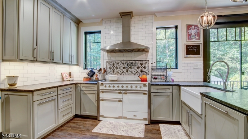 119 Broadway Road Cranbury, NJ 08512 - Photo 3 of 26 a kitchen with stainless steel appliances a sink stove and cabinets