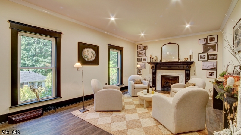 119 Broadway Road Cranbury, NJ 08512 - Photo 7 of 26 a living room with furniture a window and a fireplace