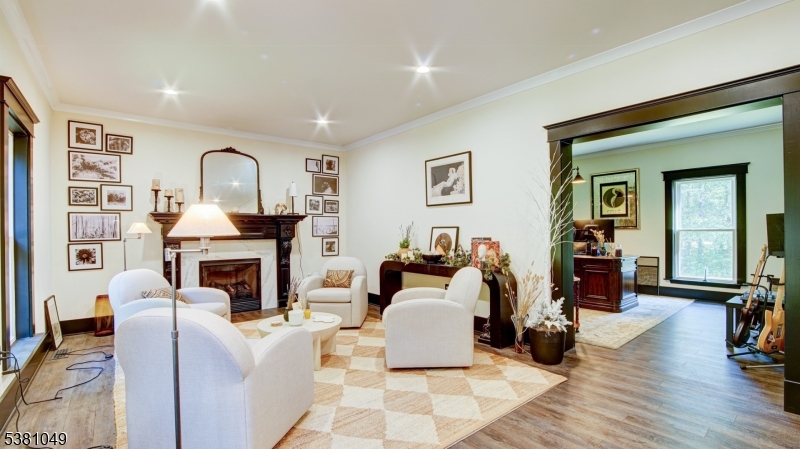 119 Broadway Road Cranbury, NJ 08512 - Photo 8 of 26 a living room with furniture and a fireplace