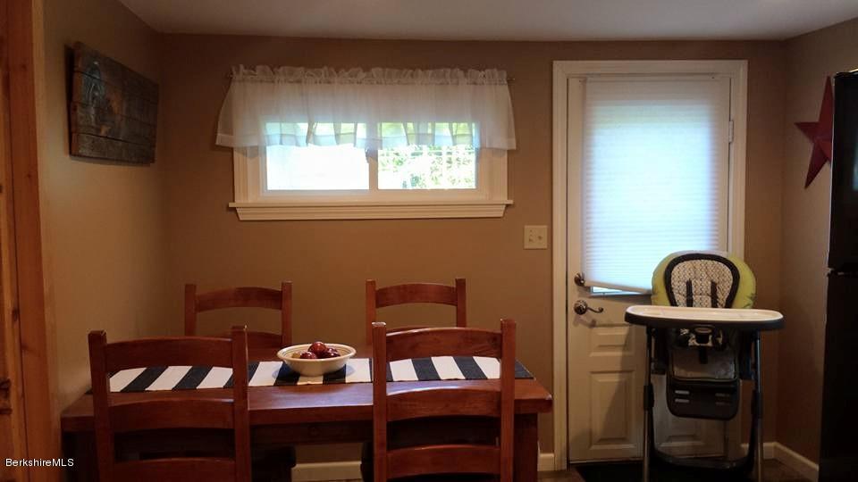 1288 Old Rte 9 Windsor, MA 01270 - Photo 11 of 21 a view of a dining room with furniture and chandelier