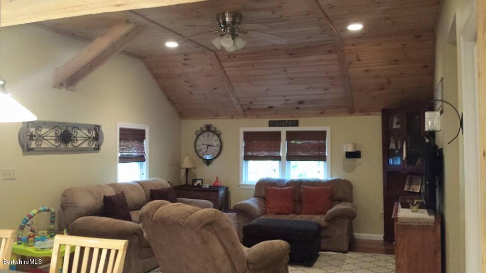 1288 Old Rte 9 Windsor, MA 01270 - Photo 12 of 21 a living room with furniture and a clock