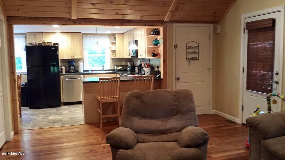1288 Old Rte 9 Windsor, MA 01270 - Photo 13 of 21 a living room with furniture and a dining table with kitchen view
