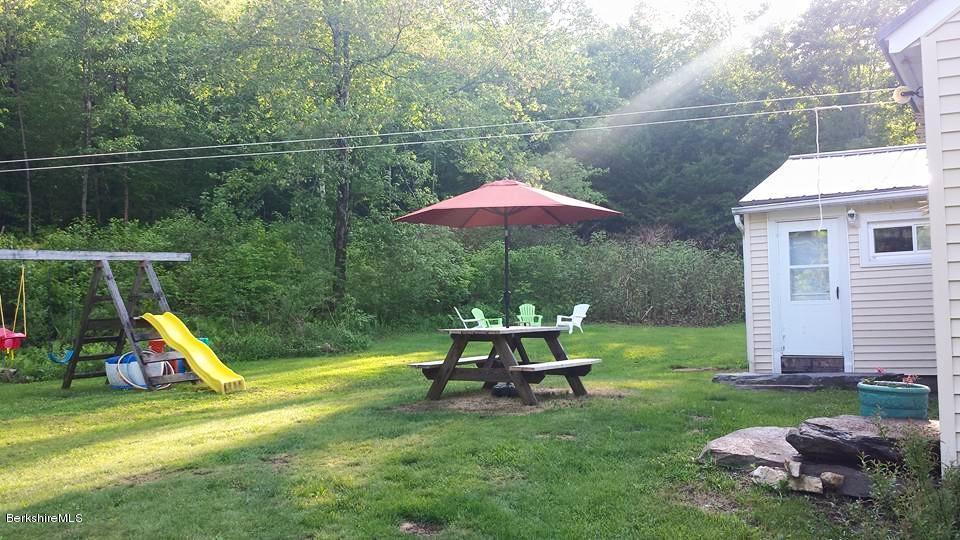 1288 Old Rte 9 Windsor, MA 01270 - Photo 8 of 21 a view of a chair and table under an umbrella