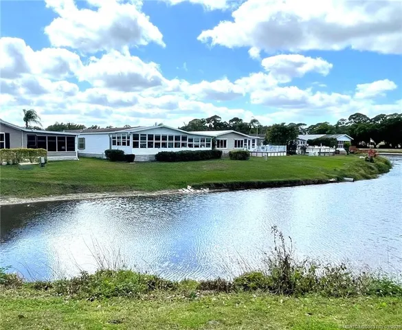 a view of a fountain in front of a lake