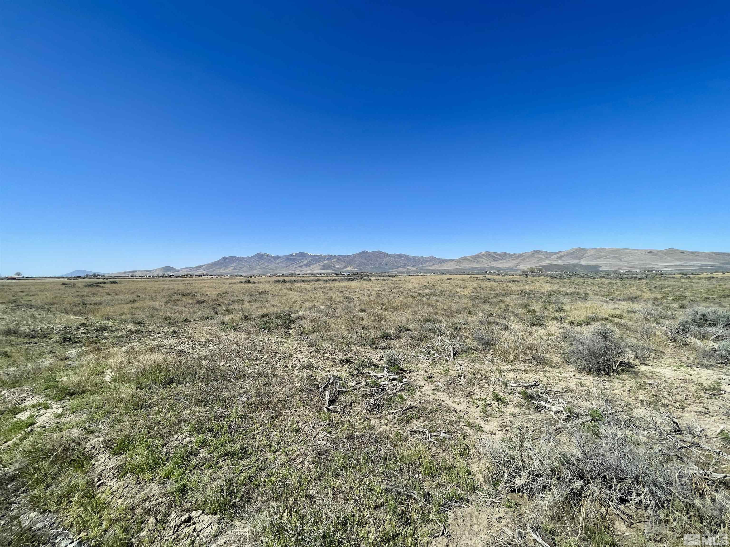 6009210th Winnemucca, NV 89445 - Photo 6 of 7 a view of a large building with mountains in the background