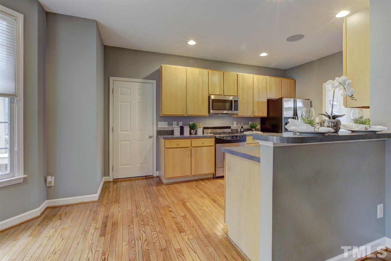 1403 Haventree Road Durham, NC 27713 - Photo 2 of 18 Another view of the kitchen with gorgeous Refinished HARDWOOD floors which flow throughout almost the entire home! Fresh paint and smooth ceilings - everything you want!