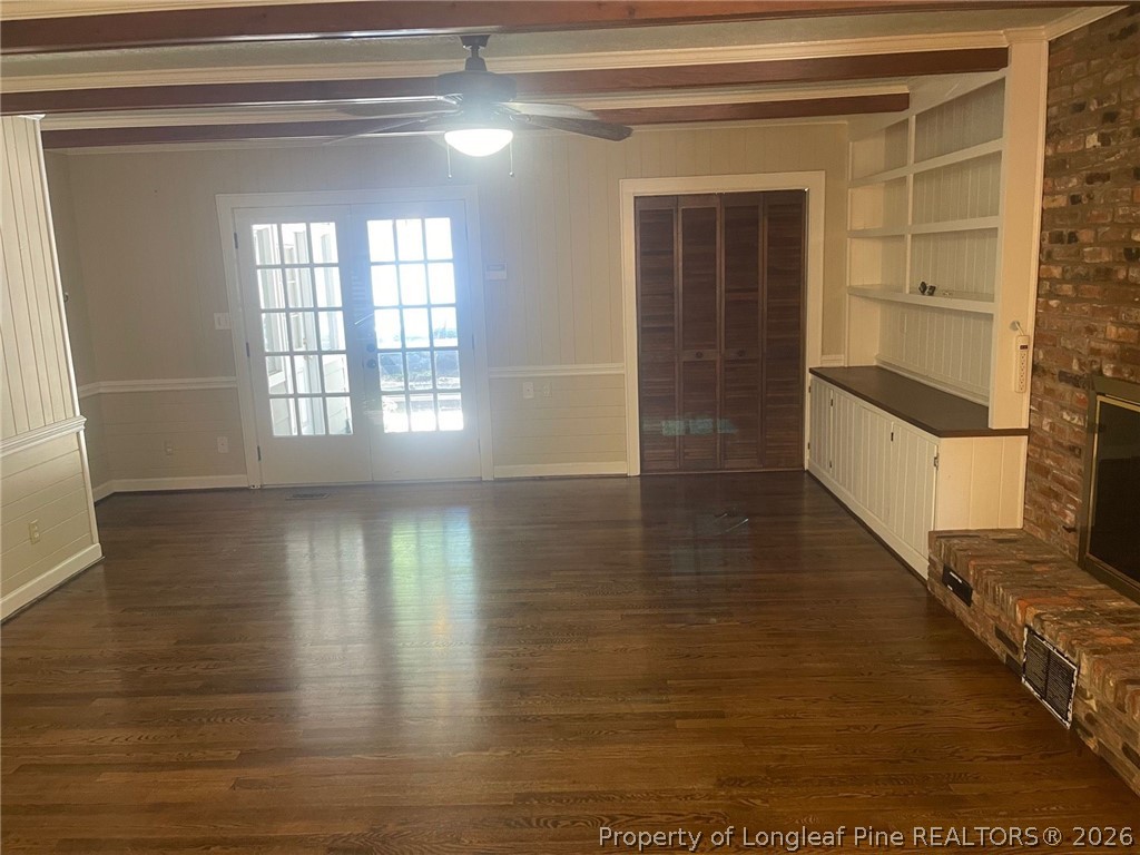 2515 Fort Bragg Road Fayetteville, NC 28303 - Photo 7 of 23 a view of a room with wooden floor and windows