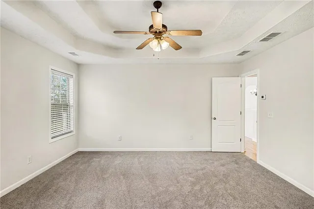 a view of empty room with windows