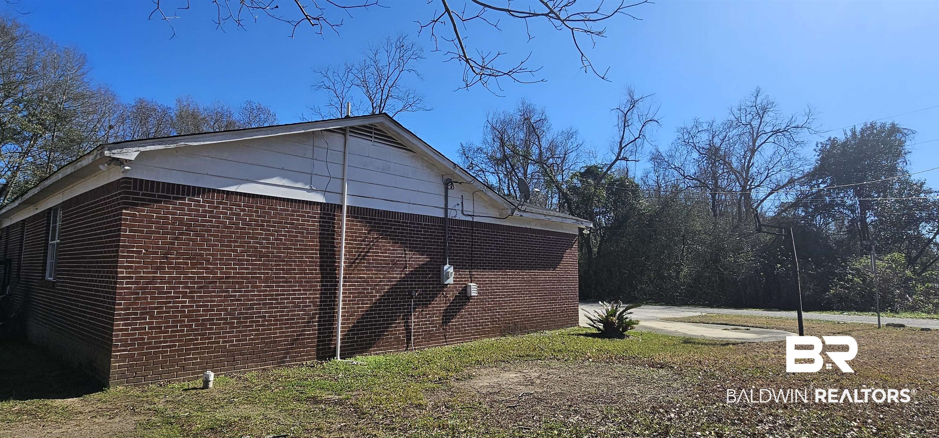 151 Bullard Street Atmore, AL 36502 - Photo 37 of 38 View of home's exterior featuring brick siding