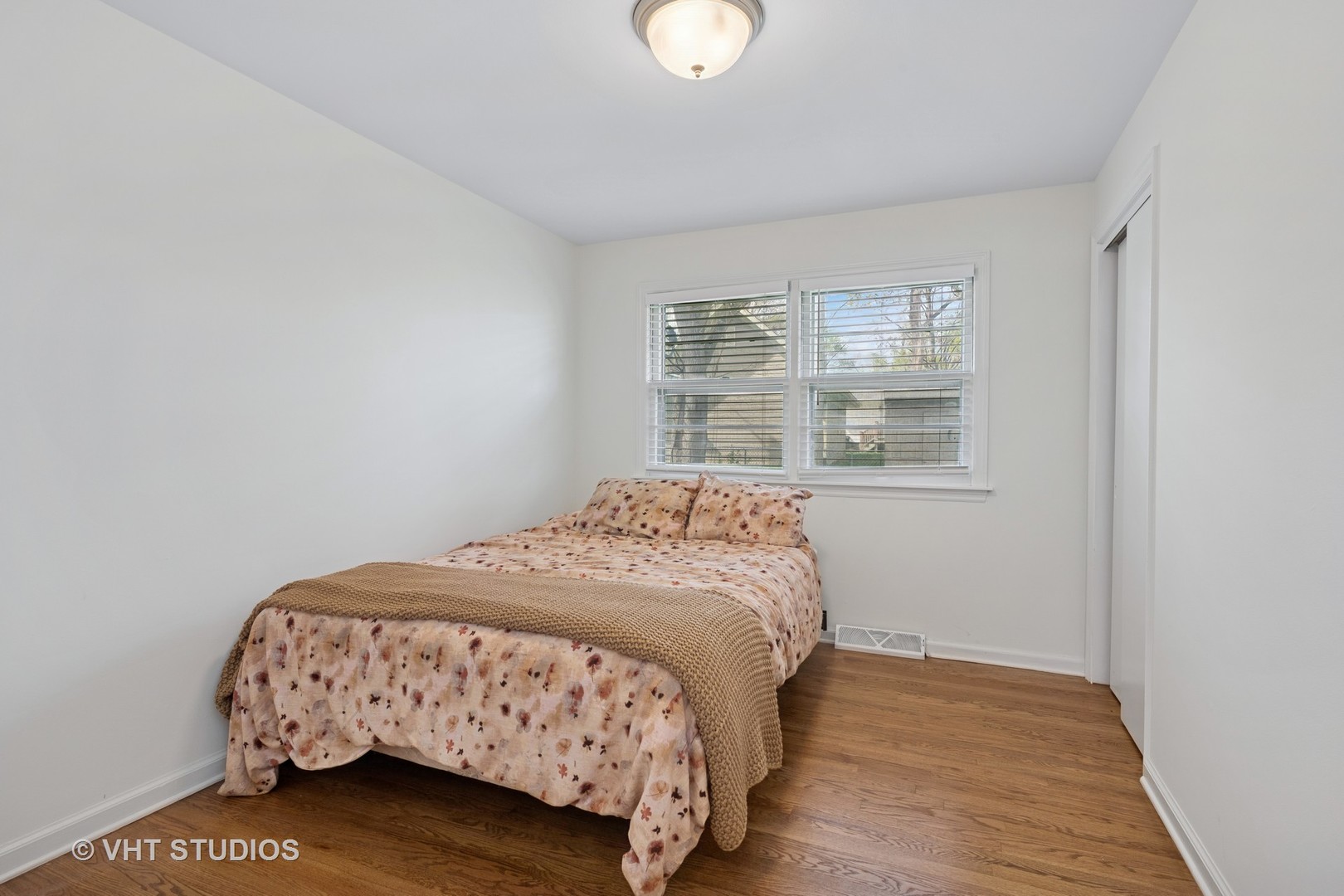 54 Burton Avenue Cary, IL 60013 - Photo 12 of 20 a bedroom with a bed and a window