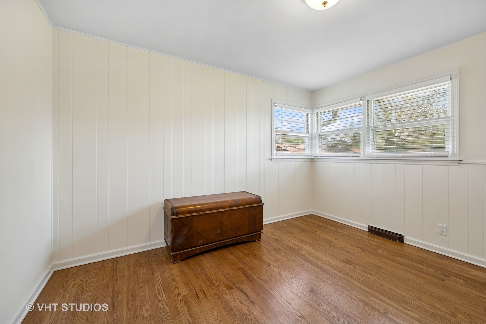 54 Burton Avenue Cary, IL 60013 - Photo 13 of 20 an empty room with wooden floor and windows
