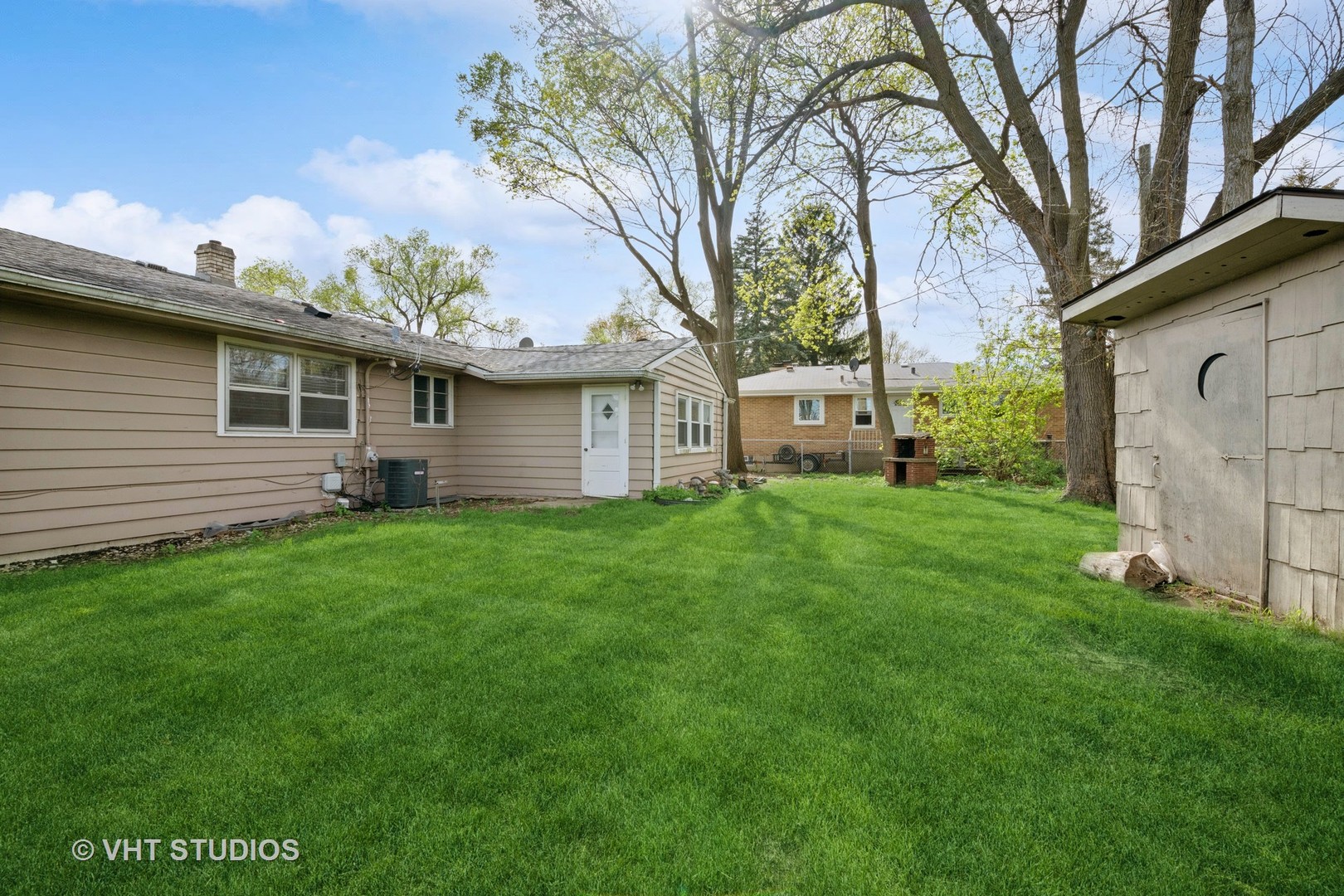 54 Burton Avenue Cary, IL 60013 - Photo 19 of 20 a view of a house with a yard