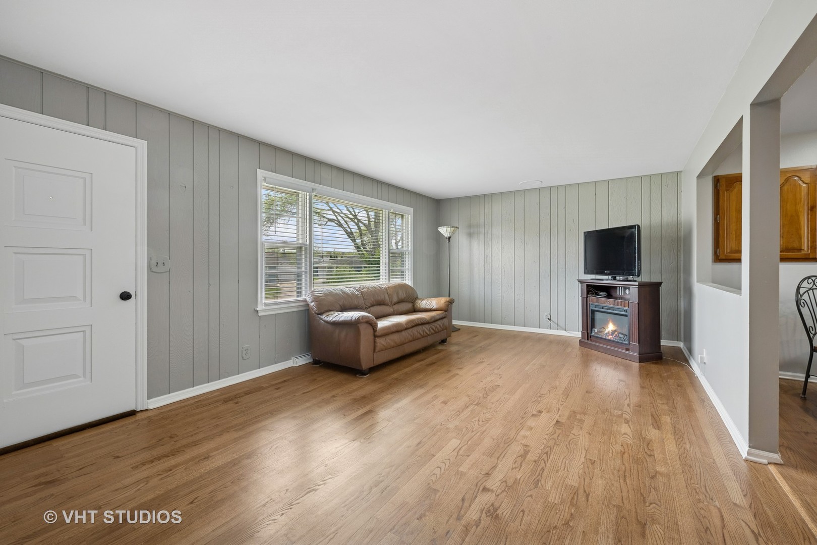 54 Burton Avenue Cary, IL 60013 - Photo 3 of 20 a living room with furniture and a flat screen tv