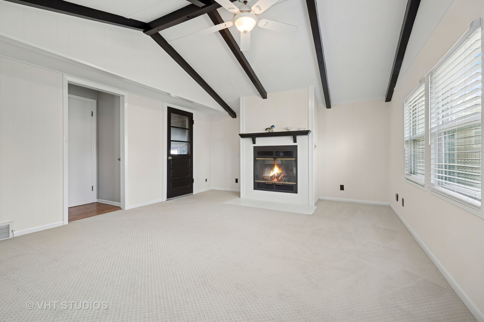 54 Burton Avenue Cary, IL 60013 - Photo 10 of 20 a view of empty room with windows and fireplace