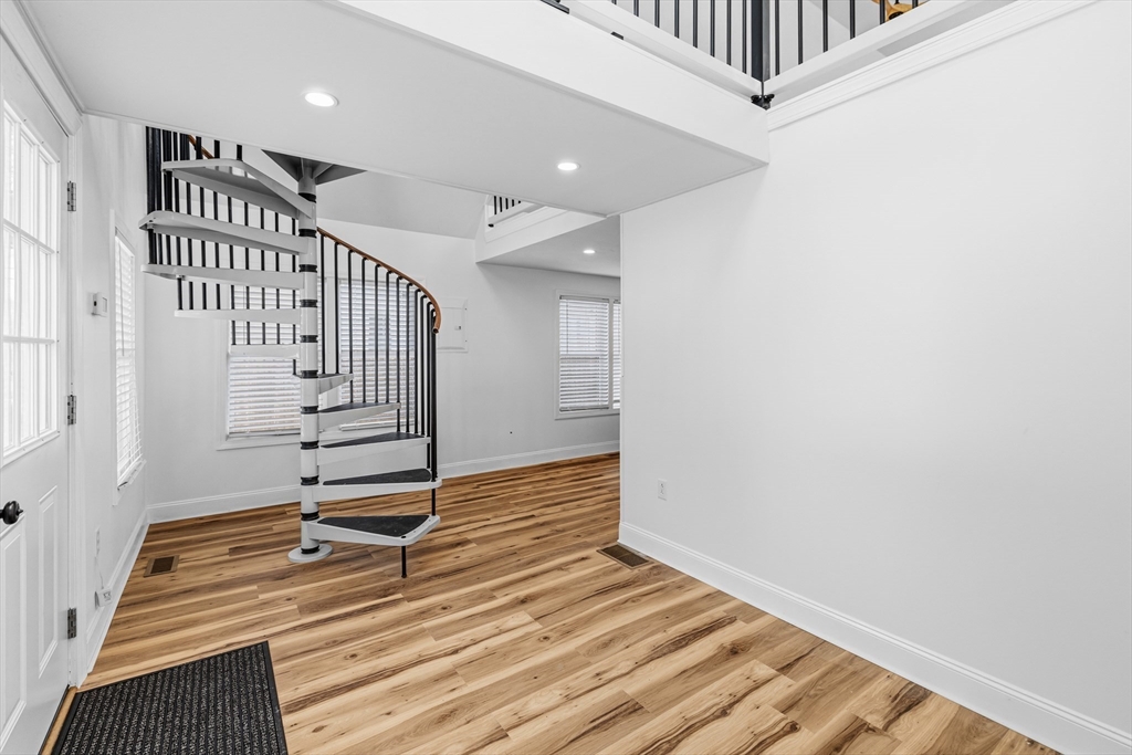 8 Cottage Street Wareham, MA 02571 - Photo 2 of 30 a view of entryway with stairs and wooden floor