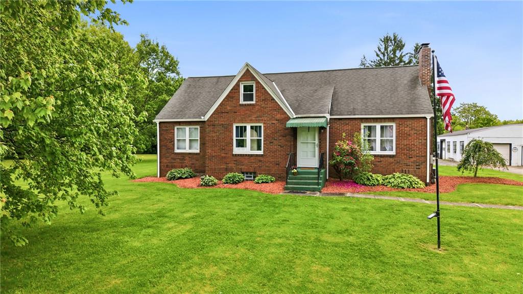 7376 Sharon-Mercer Road Mercer, PA 16137 - Photo 2 of 49 a front view of house with yard and green space