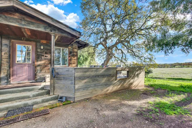 a view of a table and chairs in the garden