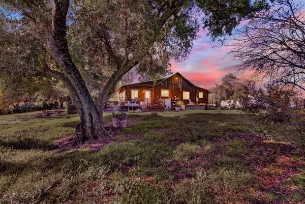 a view of house with outdoor space and trees