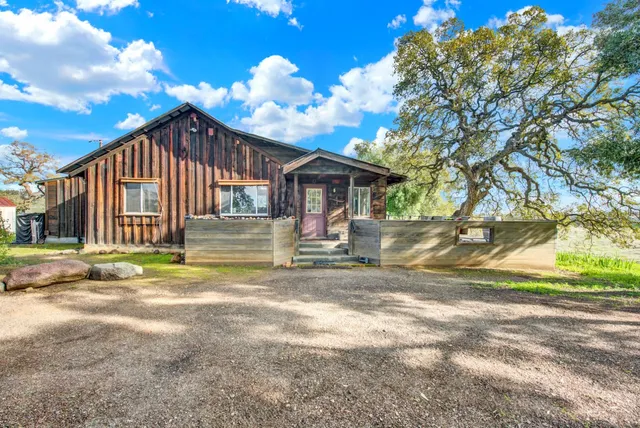 a backyard of a house with lots of green space