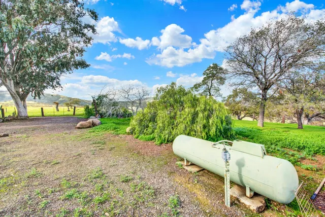 a backyard of a house with lots of green space
