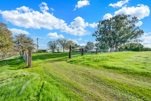 a view of a lake with a yard