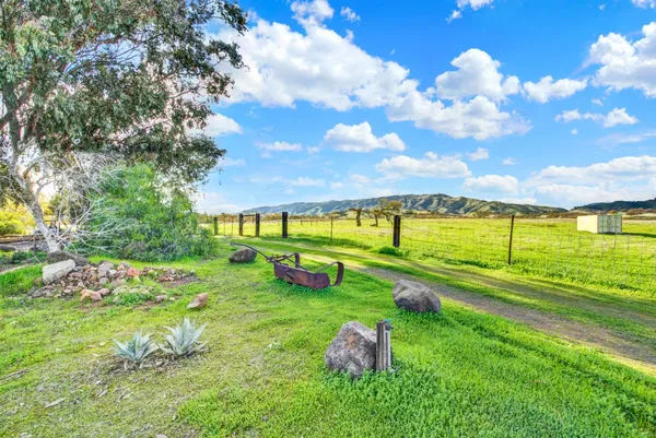 a view of a golf course with swimming pool