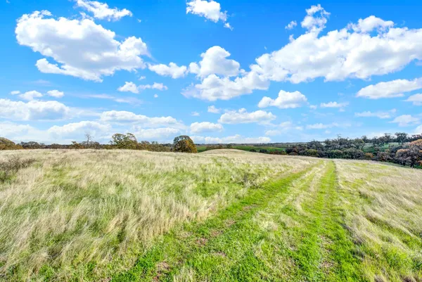 a view of a lake with a yard