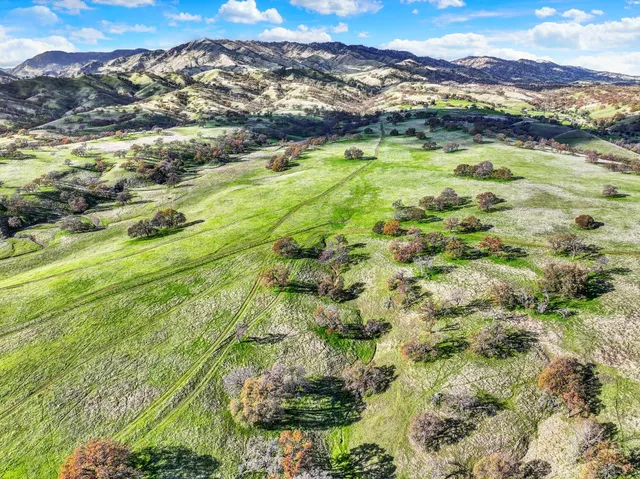 a view of a city with mountains in the background