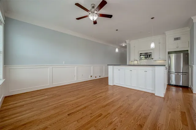 a view of a kitchen with a dishwasher and a stove top oven