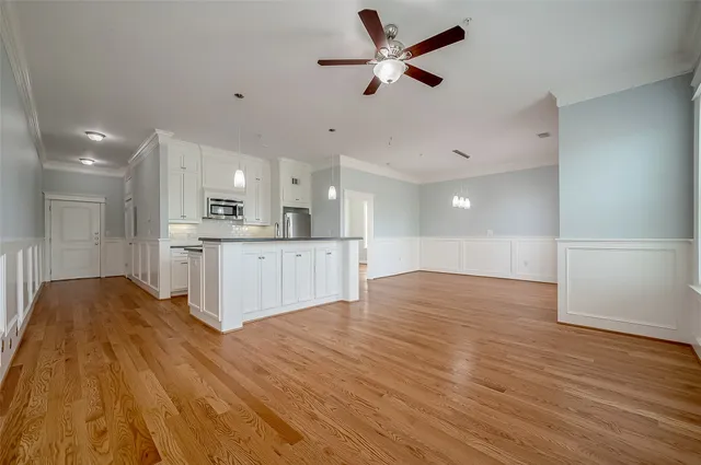 a view of kitchen with granite countertop cabinets and wooden floor