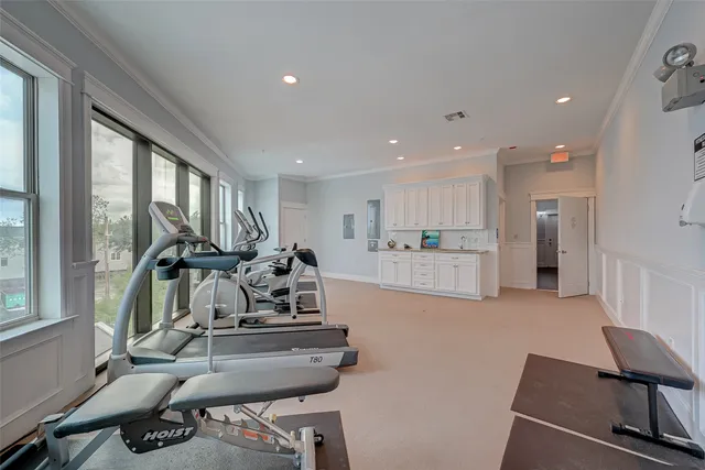 a view of a kitchen with kitchen island dining table and chairs