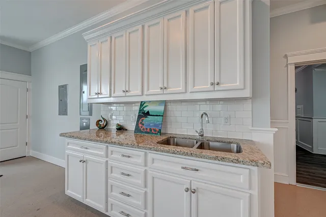 a kitchen with appliances cabinets and a sink