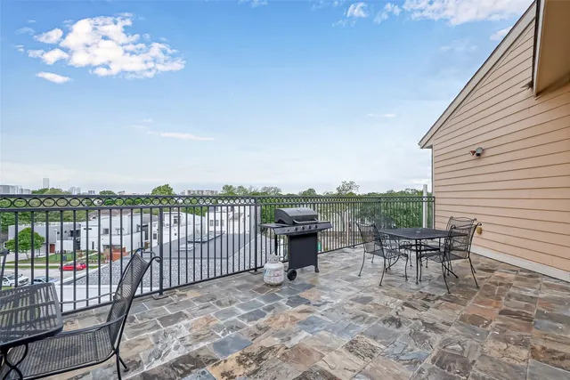 a view of a terrace with furniture