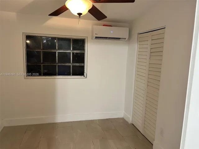 an empty room with a bench