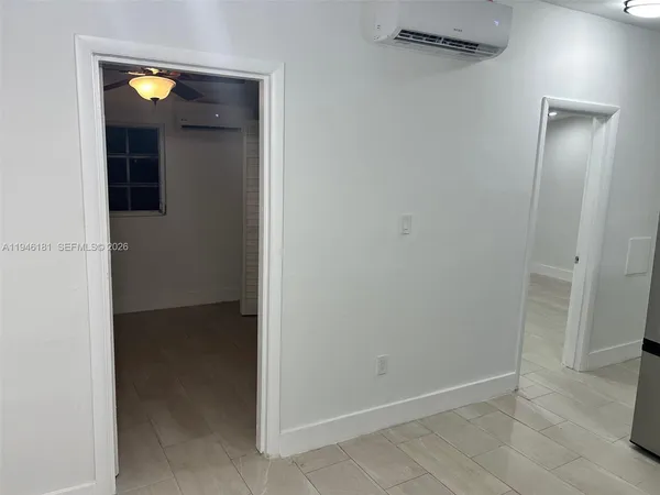 a view of an empty room with a window