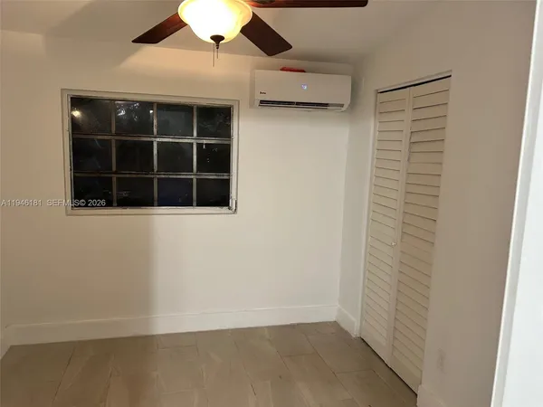 an empty room with a bench