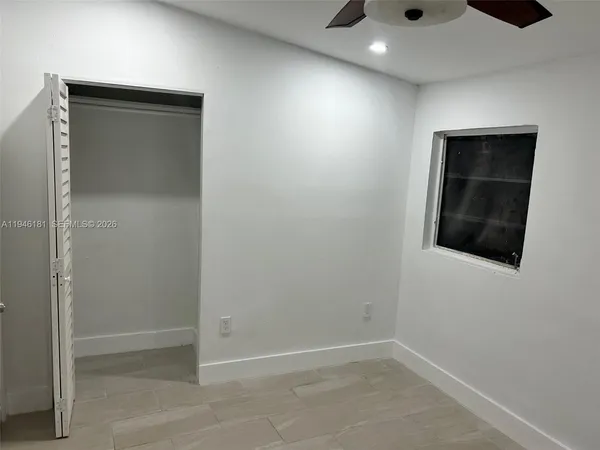 a bathroom with a toilet and shower