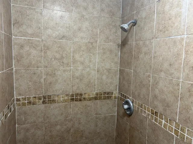 a bathroom with a sink toilet and a mirror