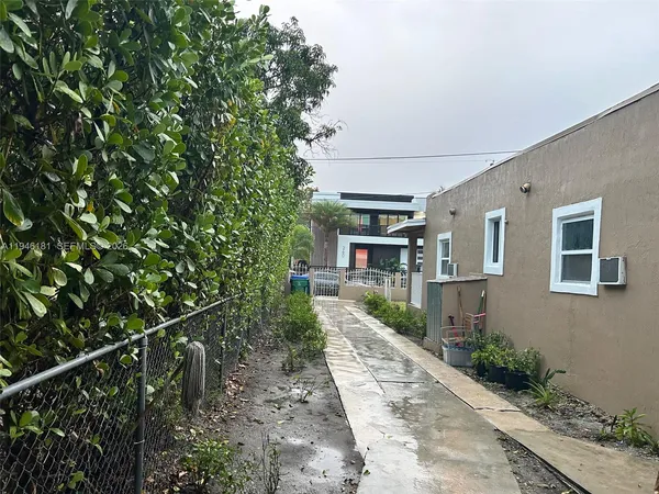 a view of a house with a tree