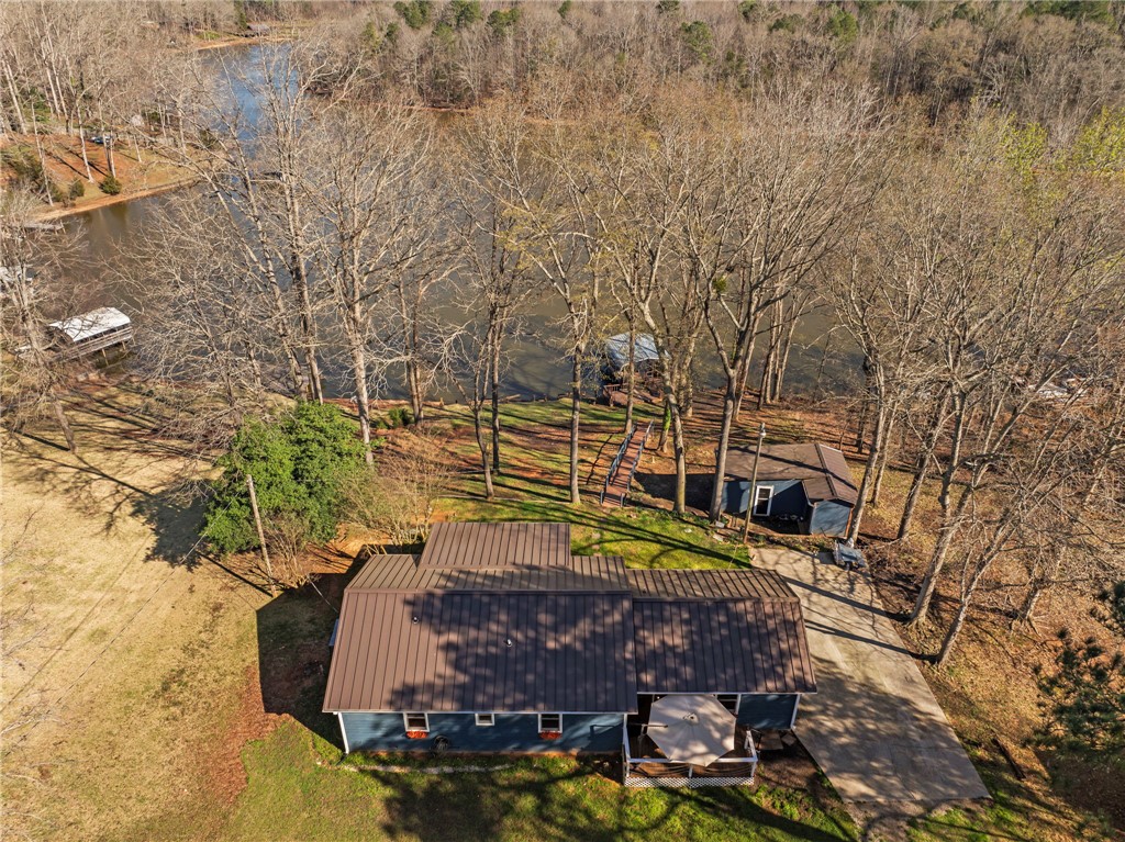 122 Latham Drive Anderson, SC 29621 - Photo 34 of 40 This tranquil lakeside residence offers direct water access and picturesque natural surroundings.