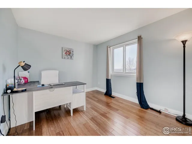 a workspace with furniture and window