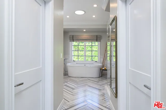 a bathroom with a bathtub and window