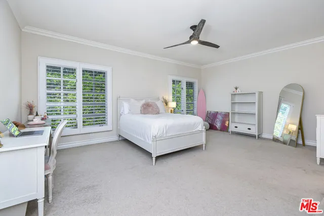 a bed room with a bed and a chair