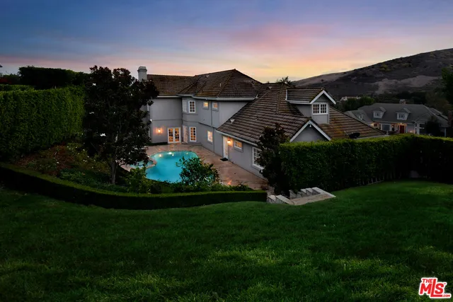 front view of a house with a garden
