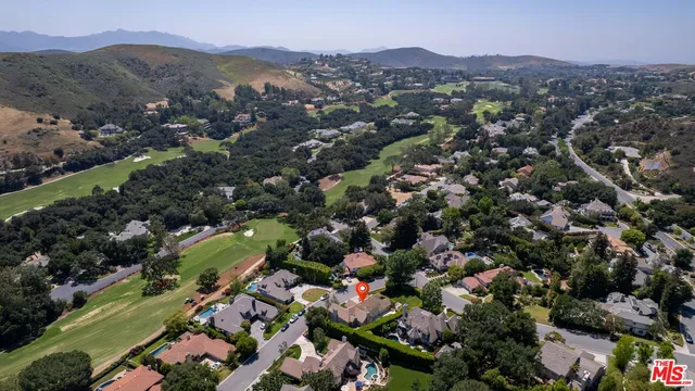 an aerial view of a town with couple of houses