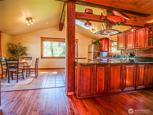 a view of a living room with furniture window and wooden floor